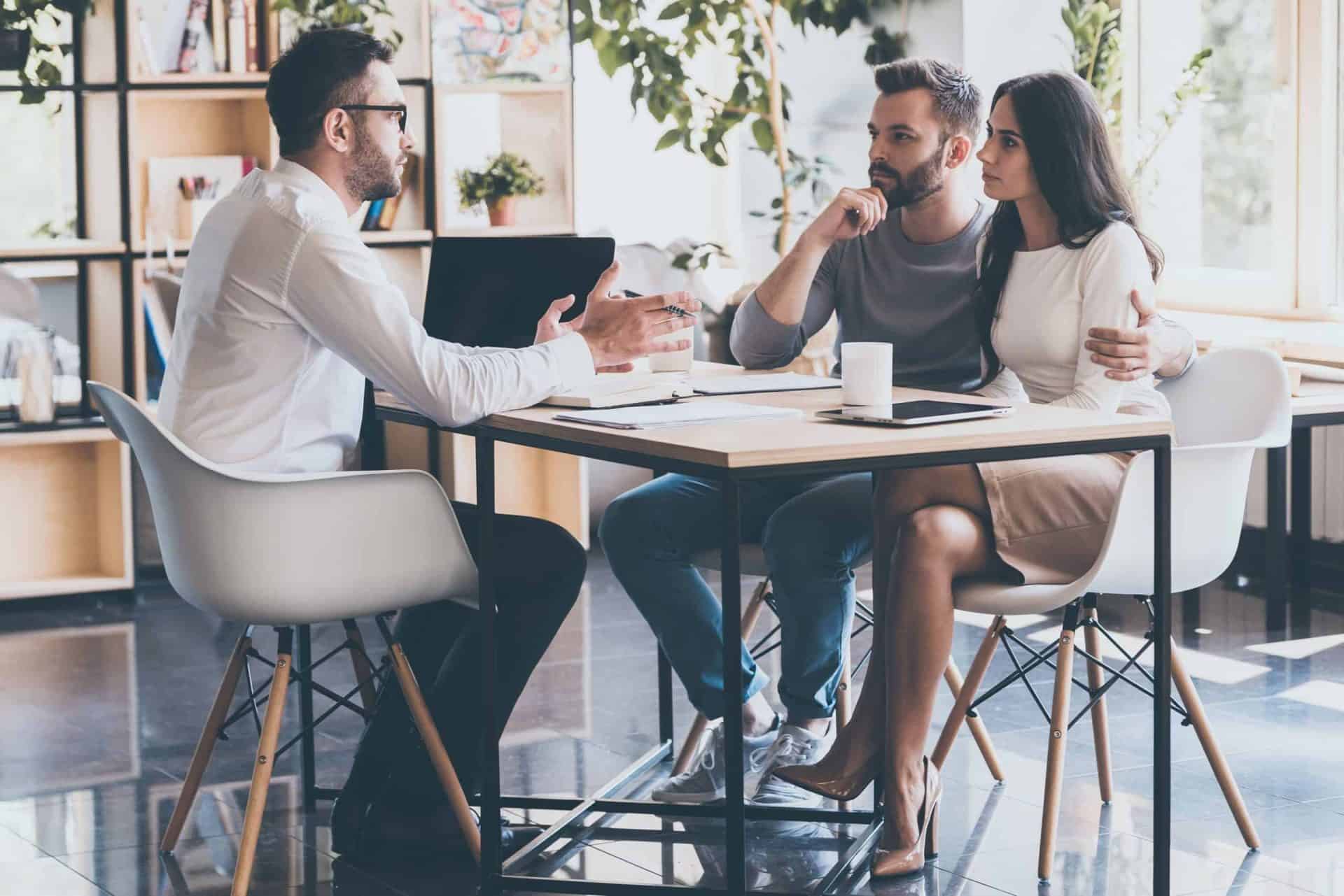 young couple at a meeting with a financial advisor