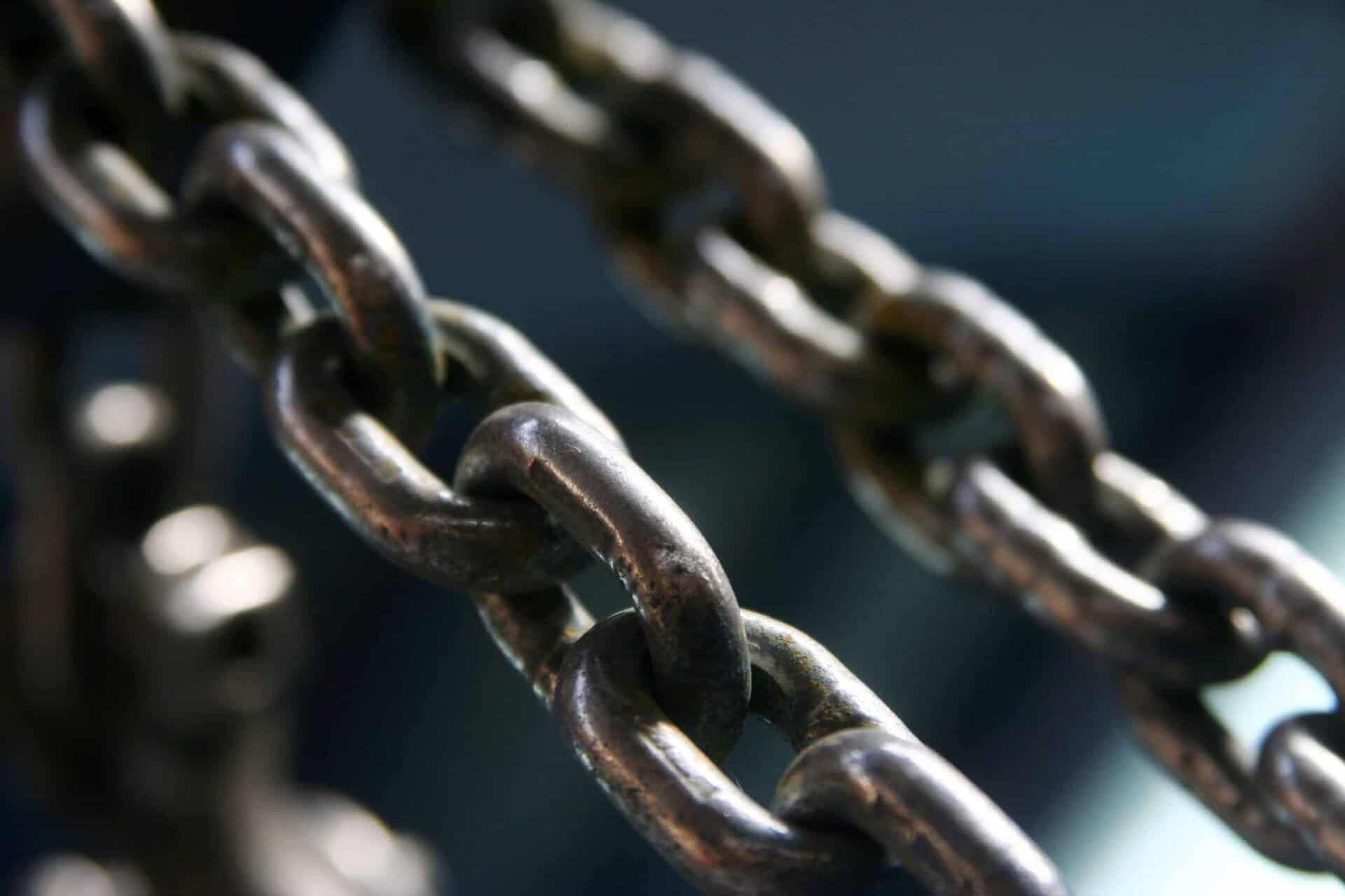 close up image of chains with dark background